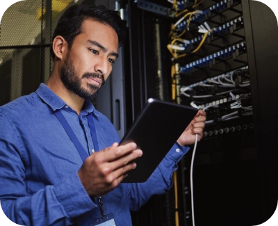 A man looking at a tablet while smiling