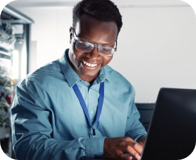 server technician smiling while working on eCommerce performance updates