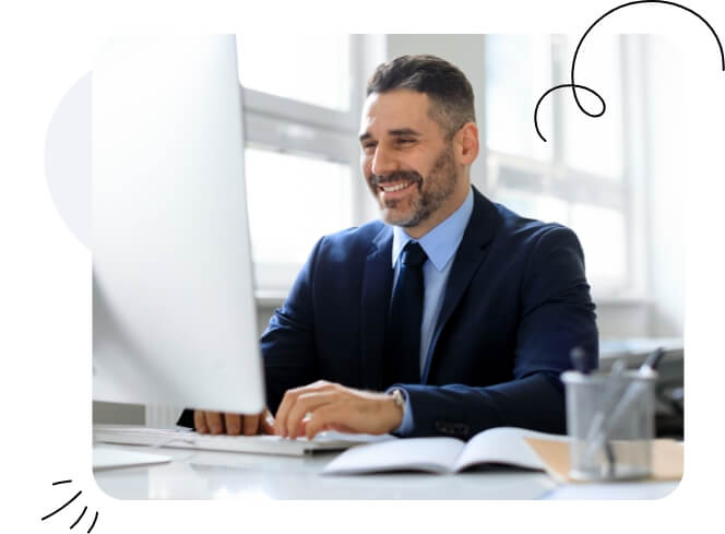 A happy man and woman looking at a Mac screen.