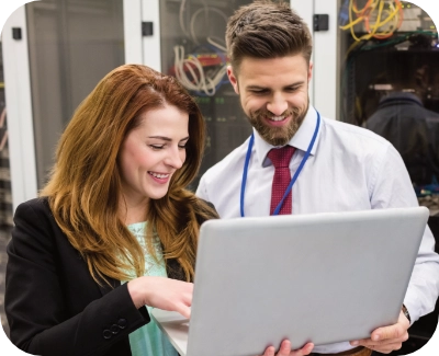 two server technicians reviewing server performance and checking for security vulnerabilities