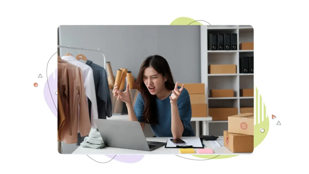 Woman frustrated sitting in front of a computer