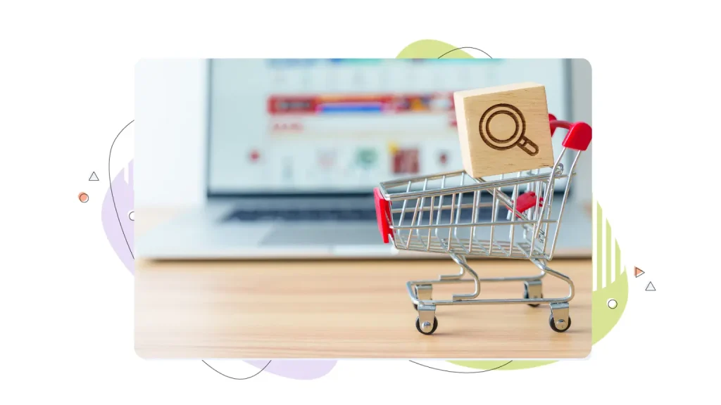 Shopping cart in front of a laptop