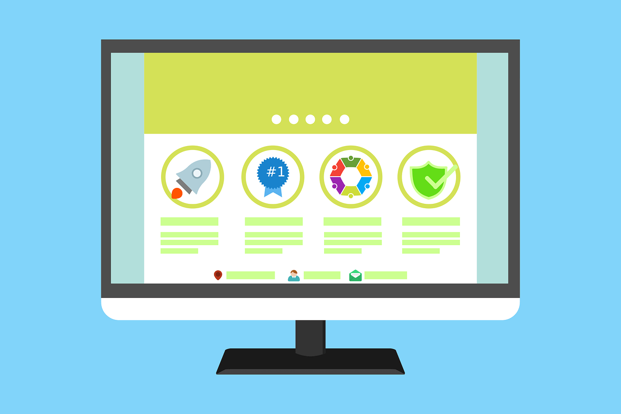 Computer screen with icons and a simple website design