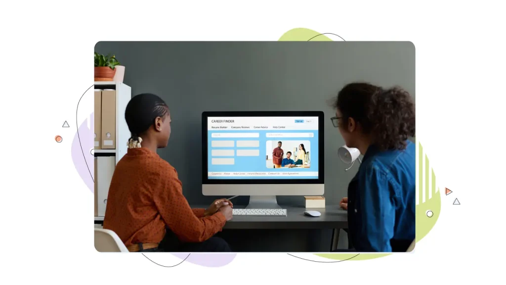 Two people looking at a website layout