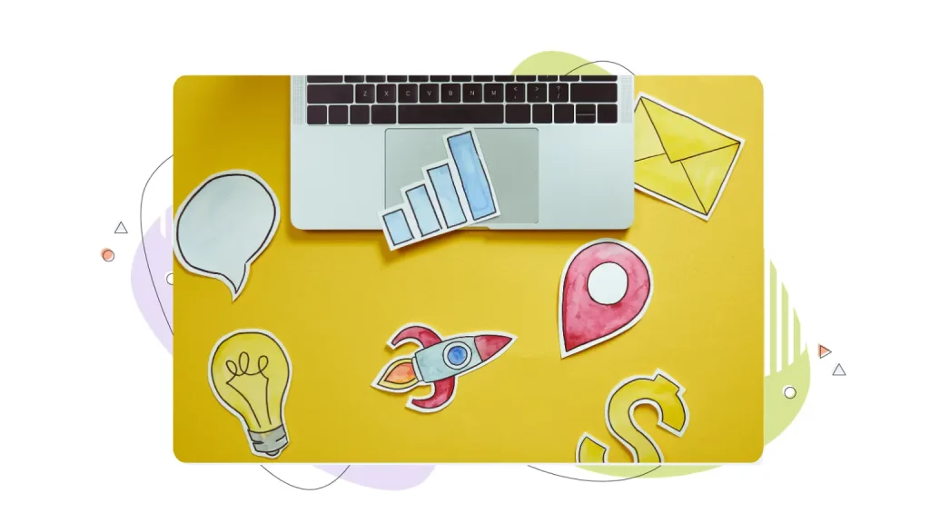 Colourful icons next to a laptop