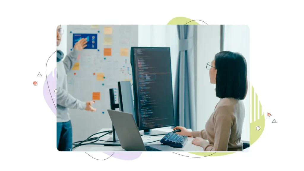 Two people looking at technical optimizations 