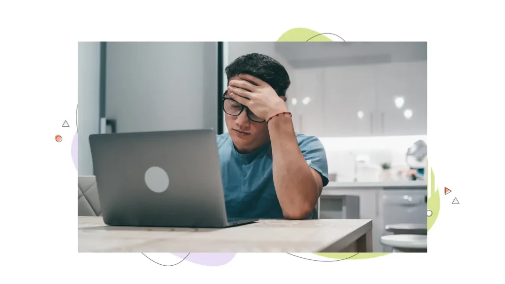 Person frustrated at a laptop