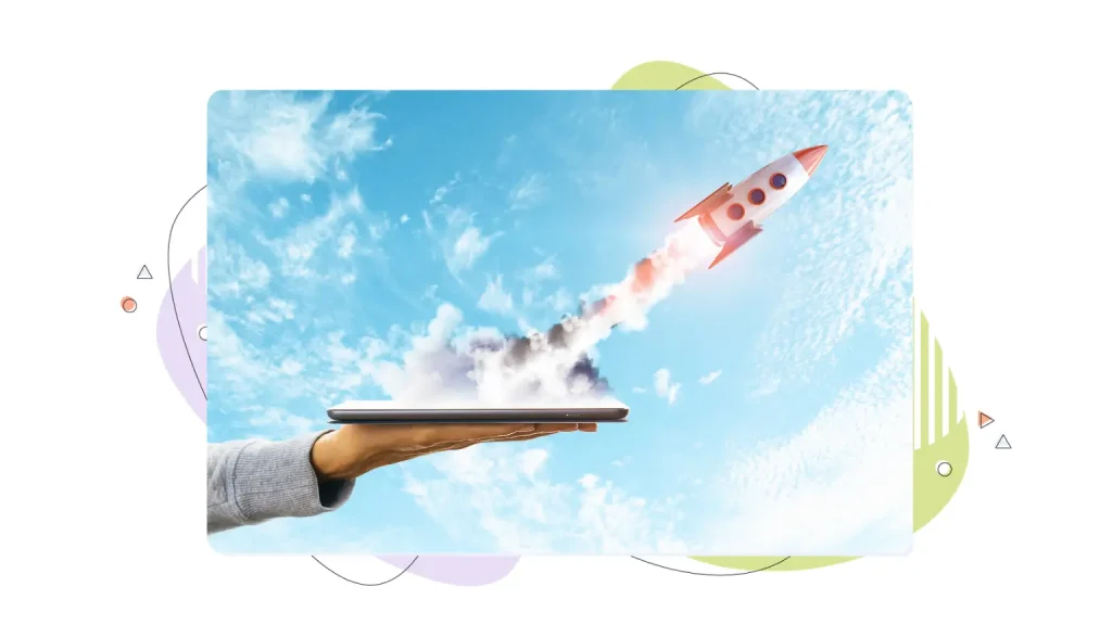 Rocket ship coming out of a laptop