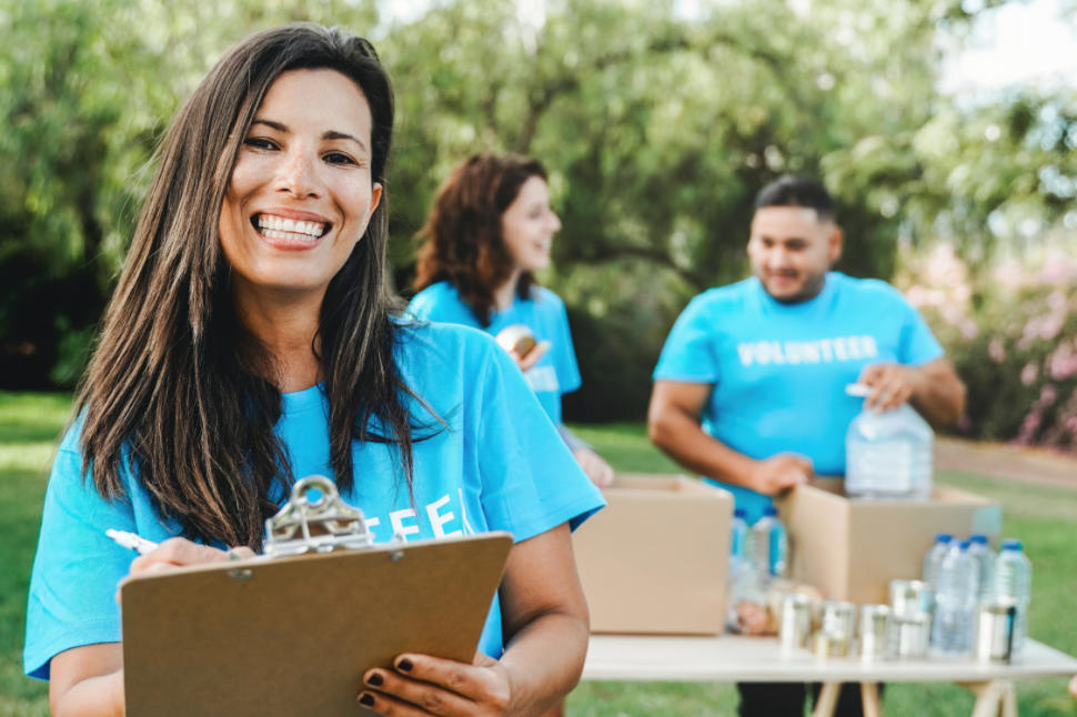 Volunteer work collecting goods and food for community service at park city. Donations and charity project concept