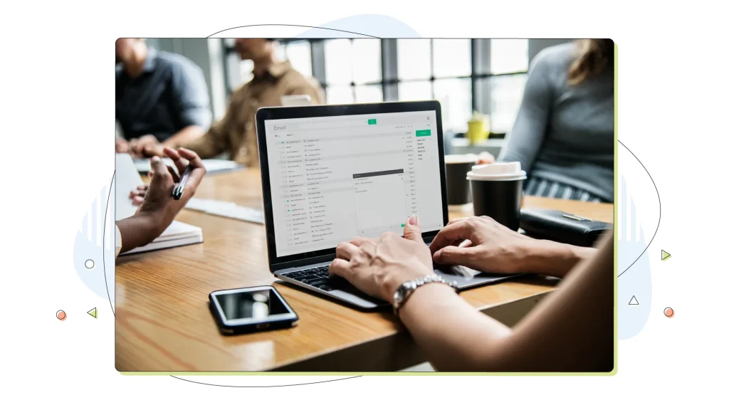 Woman checking her email in a meeting