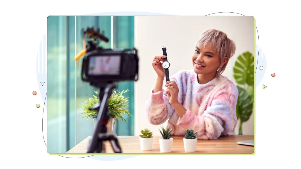Female Vlogger Recording Wristwatch Product Review Video At Home With Camera