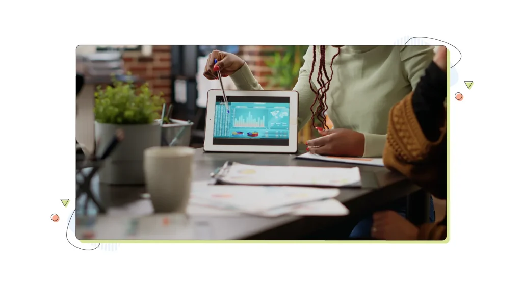 Team of people analyzing data charts report on digital tablet