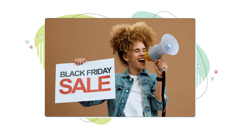 Cheerful woman shouting through megaphone while holding Black Friday sale sign.