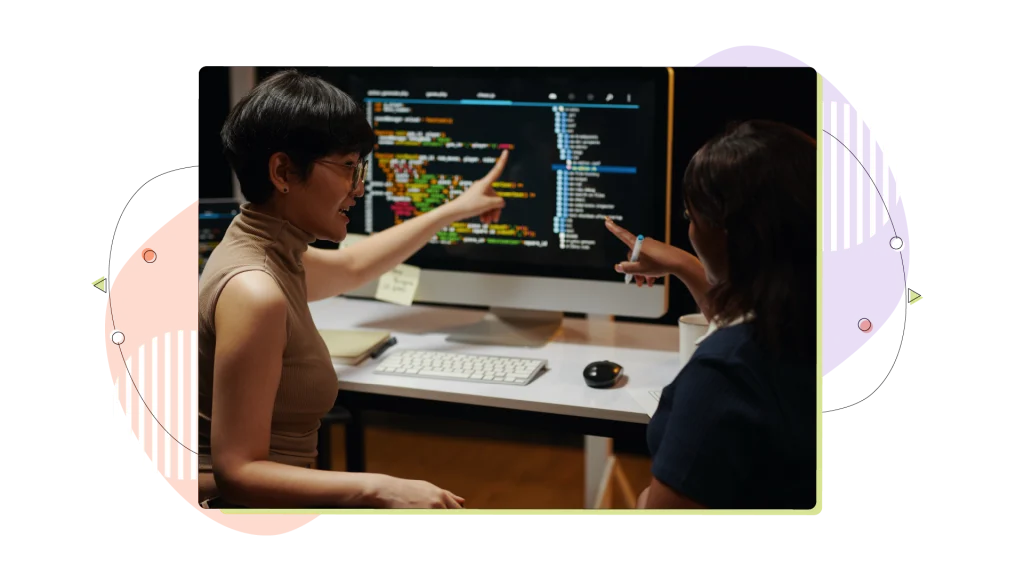 Developers Discussing Programming Code.