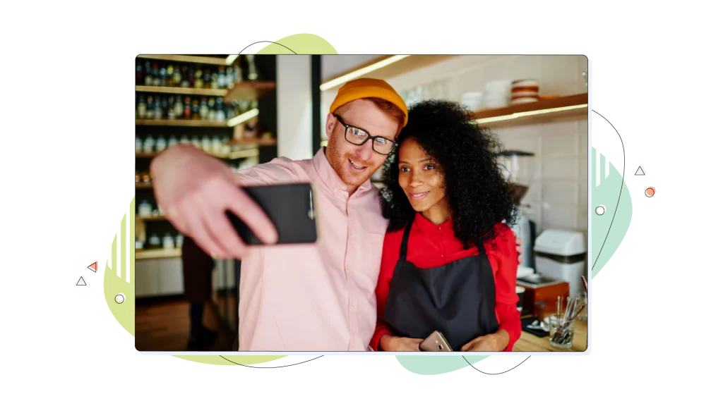Excited man taking selfie with waitress.