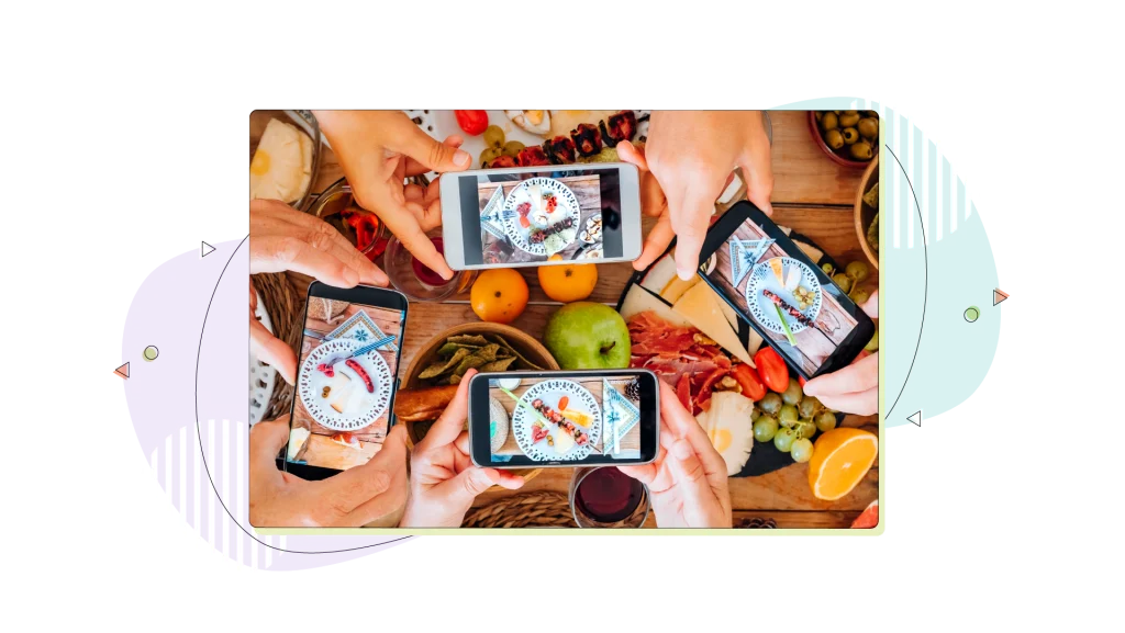 Top view of group of people taking food and dishes pictures.