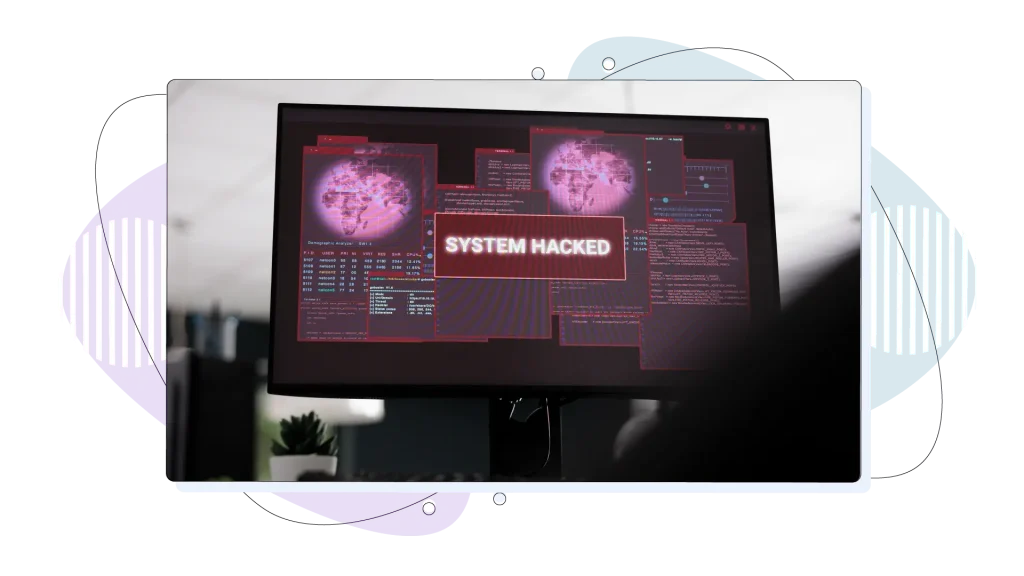 Computers displaying hacked system alert message showing on screen.