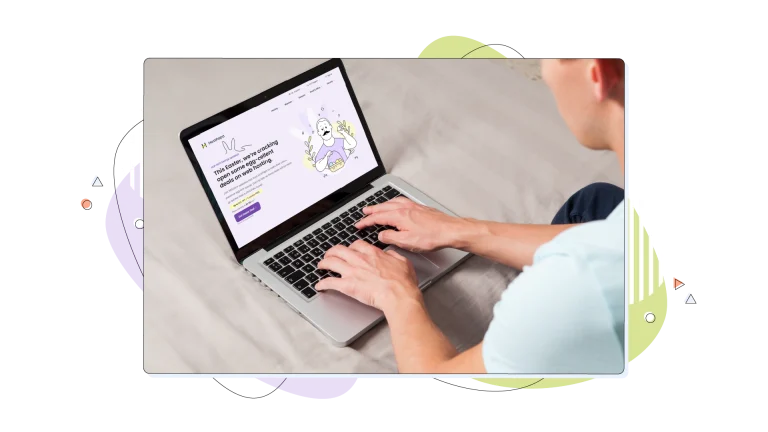 A person working on their laptop while visiting HostPapa's website
