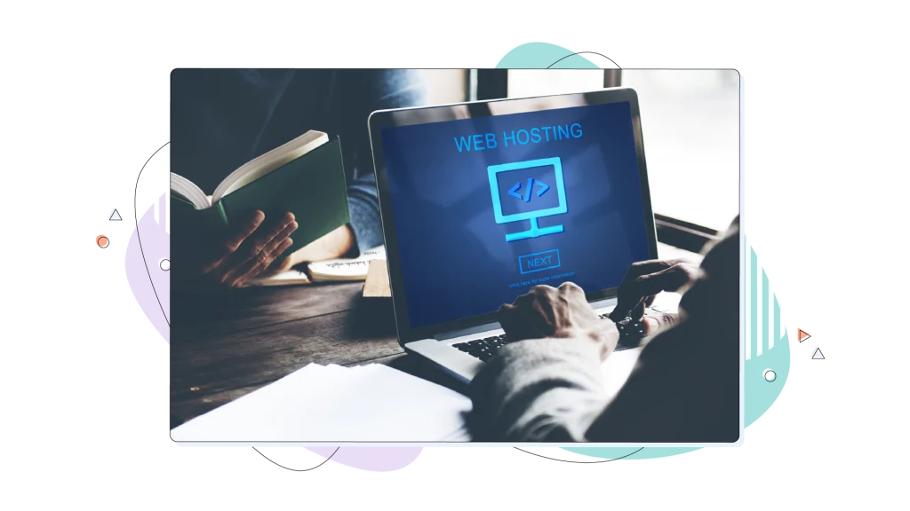 The word web hosting written on a laptop's screen while a person is typing on it.