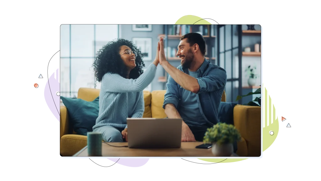 Couple making a high five for their success.