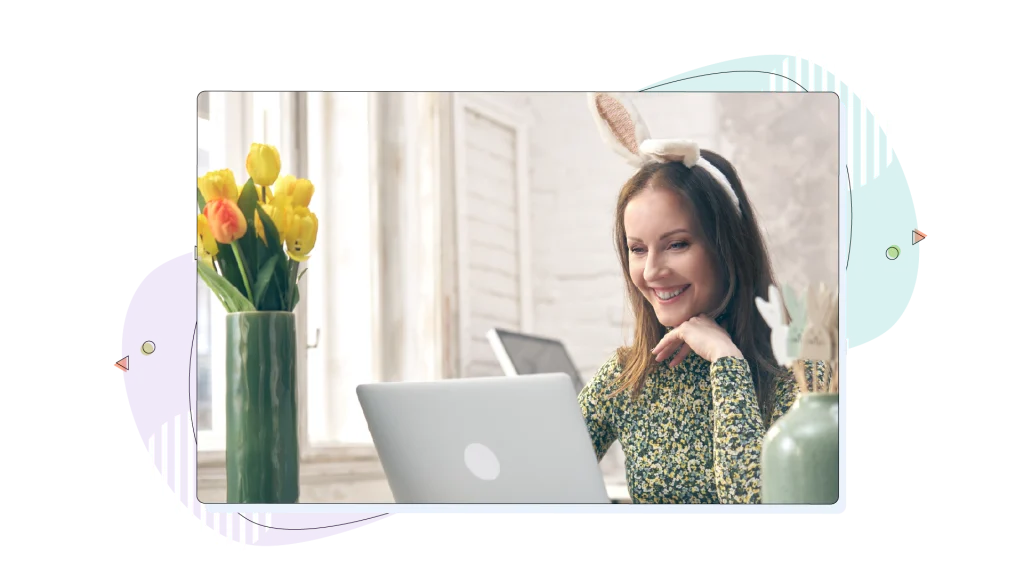 Woman wearing bunny ears for the Easter season is shopping on her laptop.