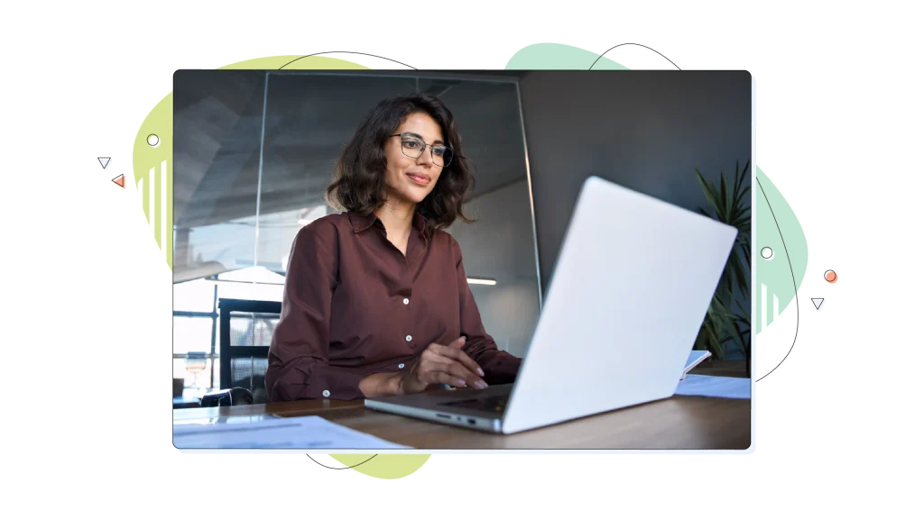 Woman working on her laptop in her office.