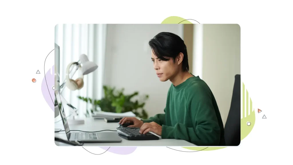 Frustrated man working on a computer
