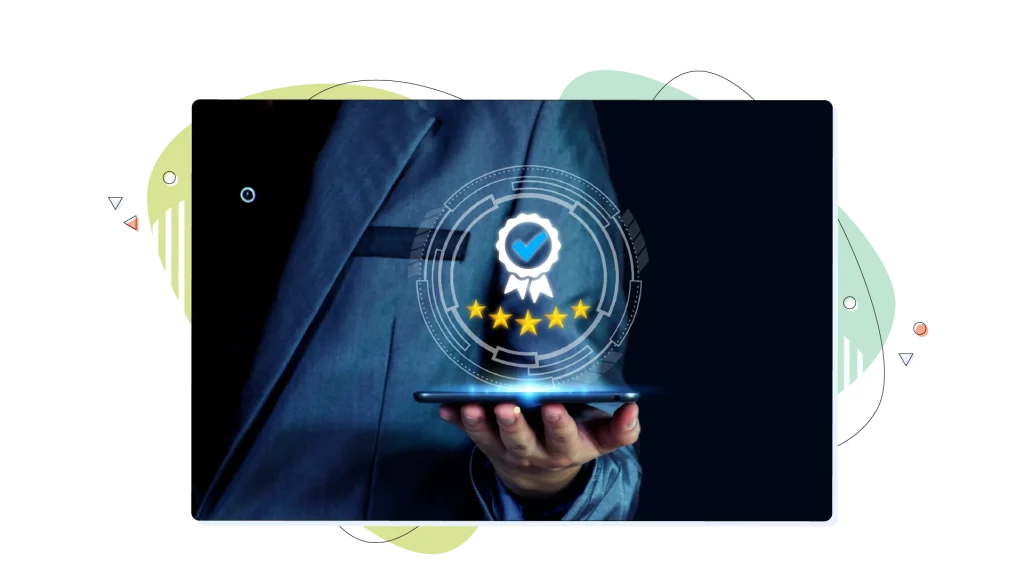 Five stars hovering over hand that holds a tablet.
