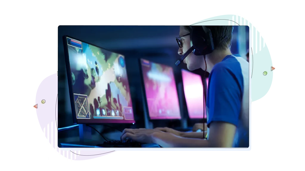 A gamer playing a game, while wearing headphones and talking to his teammates.