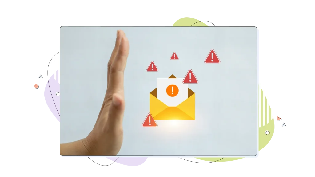 A hand making the stop sign over a folder full of spam.