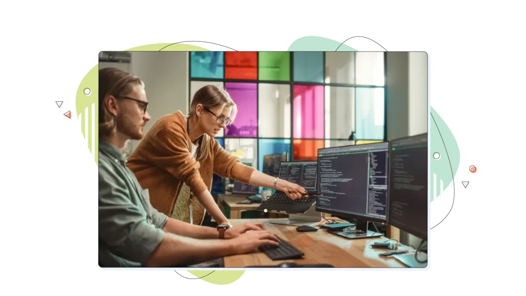 People working in the same room, looking at the monitors.