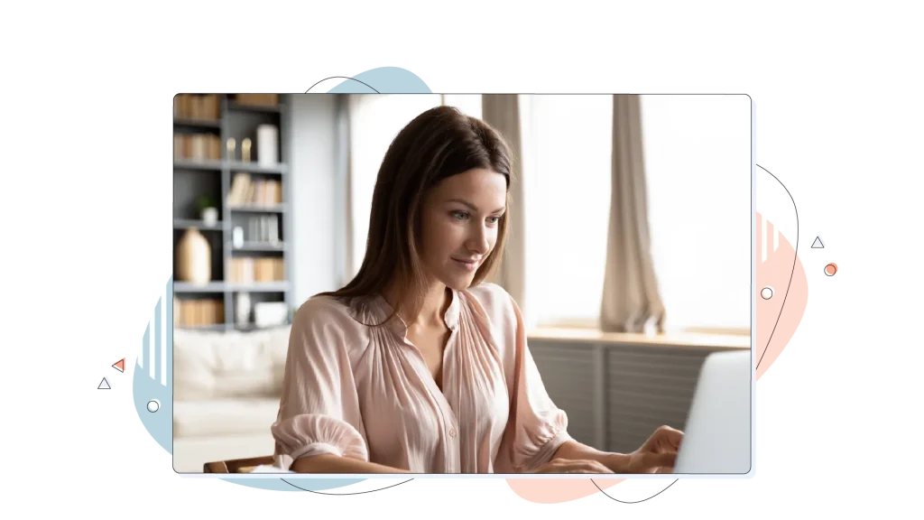 Woman surfing the internet on her laptop at the comfort of her home office.