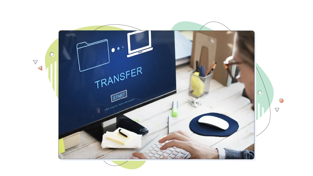Transferring files on a computer on a desktop.