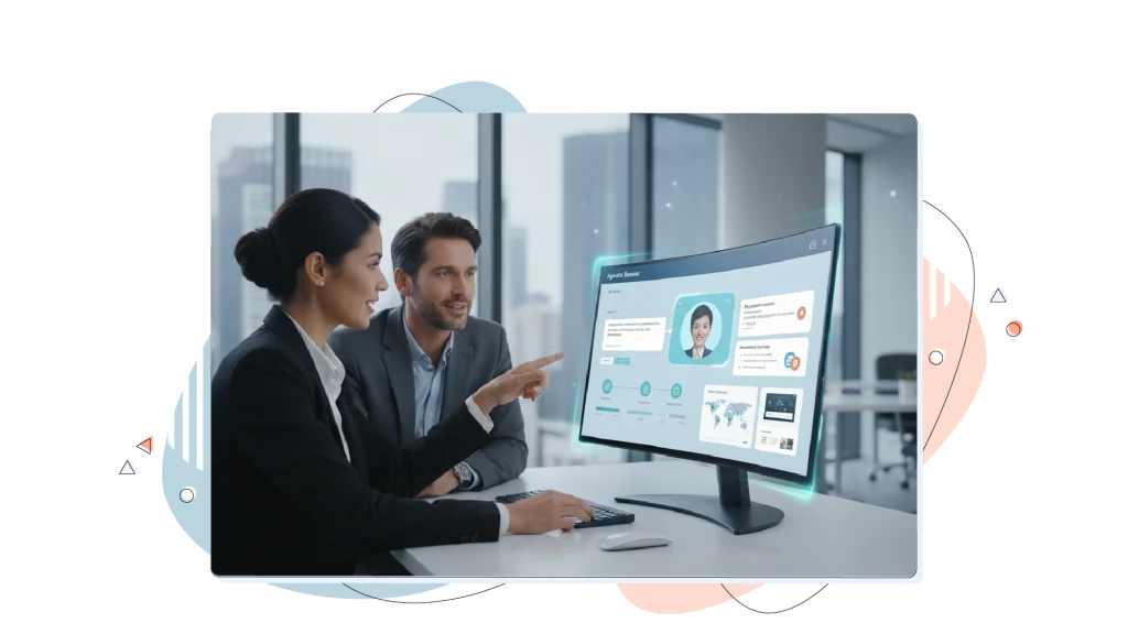 Two colleagues working on the same computer, in the office.