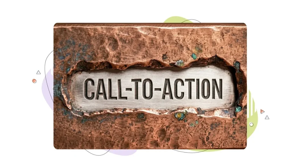 Call to action written in a metal surface behind a rock wall.