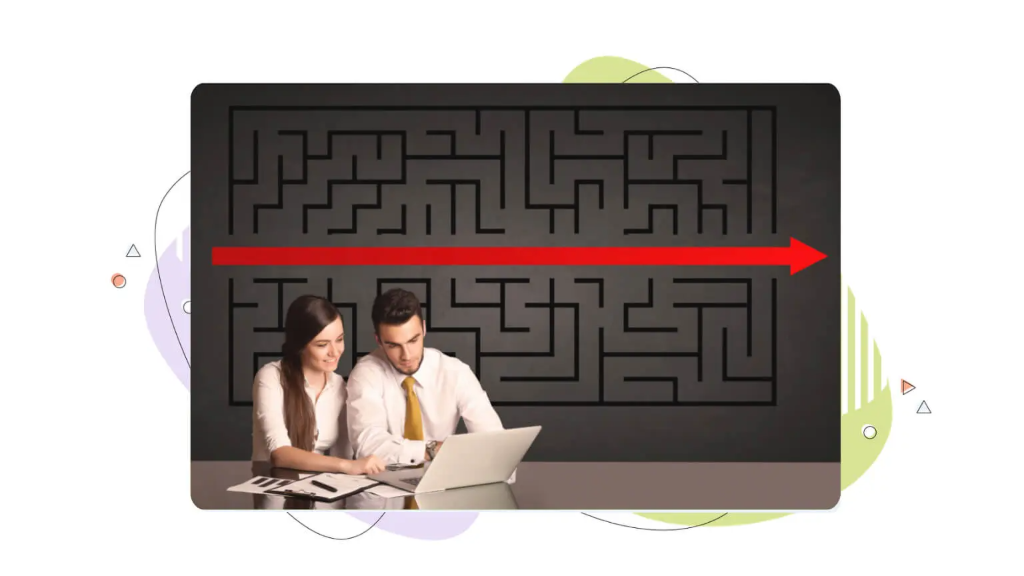 Two colleagues sitting at a computer with a maze and arrow in the background, discussing what is a domain name worth.