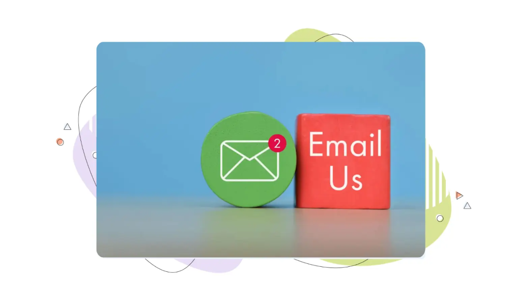Two small wooden blocks with ‘Email Us' and an email icon, used as professional email examples in a business context.