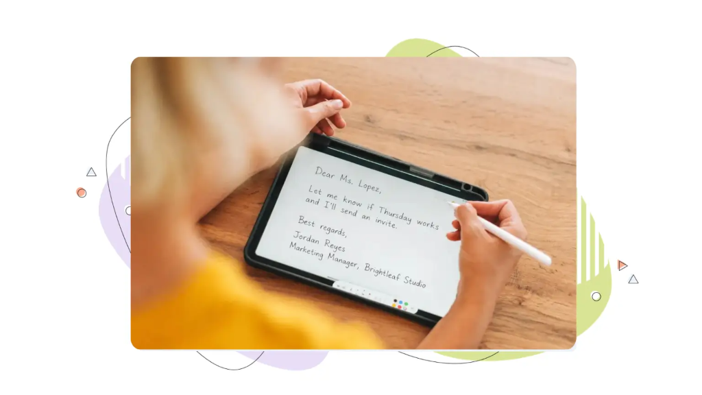 Someone creates a handwritten draft of an email on a tablet computer, practising how to start a professional email.