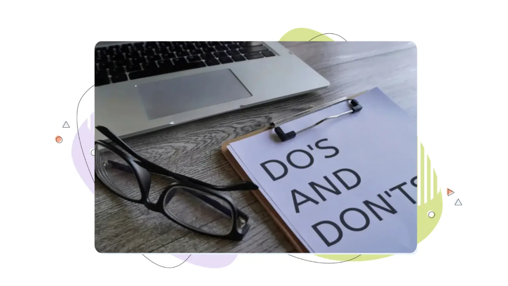 A laptop sits alongside a clipboard printed with do's and don'ts for how to write a professional email.