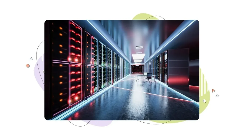 A dark server room with computers running in the background.