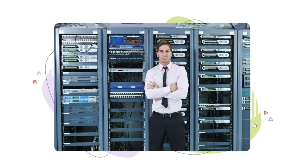 Person standing in front of server racks.