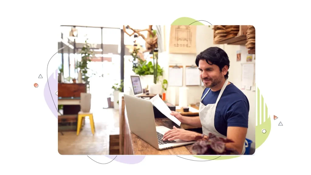 Small business owner working at a laptop