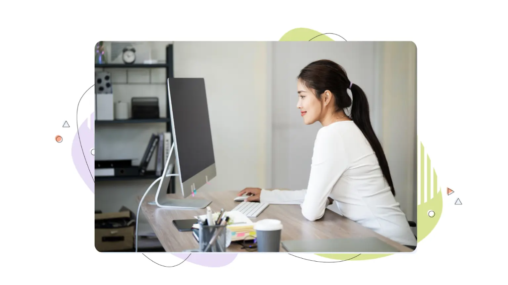 Woman considering whether a vps is worth it for wordpress while working at a computer desk.