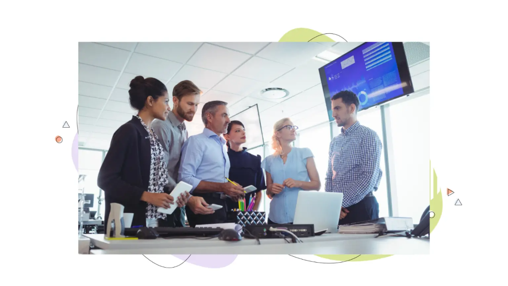 Business team reviewing metrics during a virtual private server wordpress presentation.