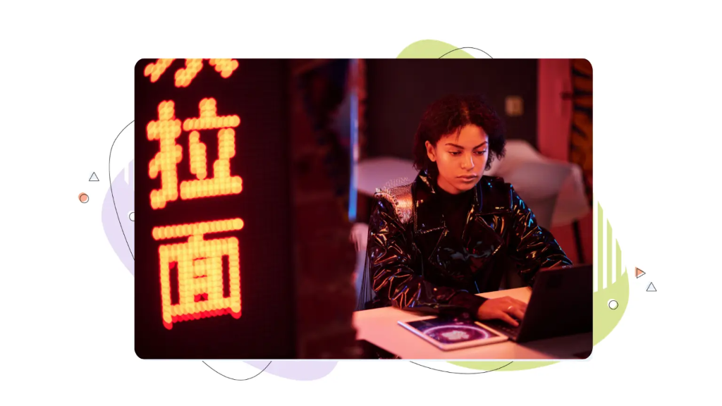 Woman working on laptop learning how to install wordpress on a vps in neon room.